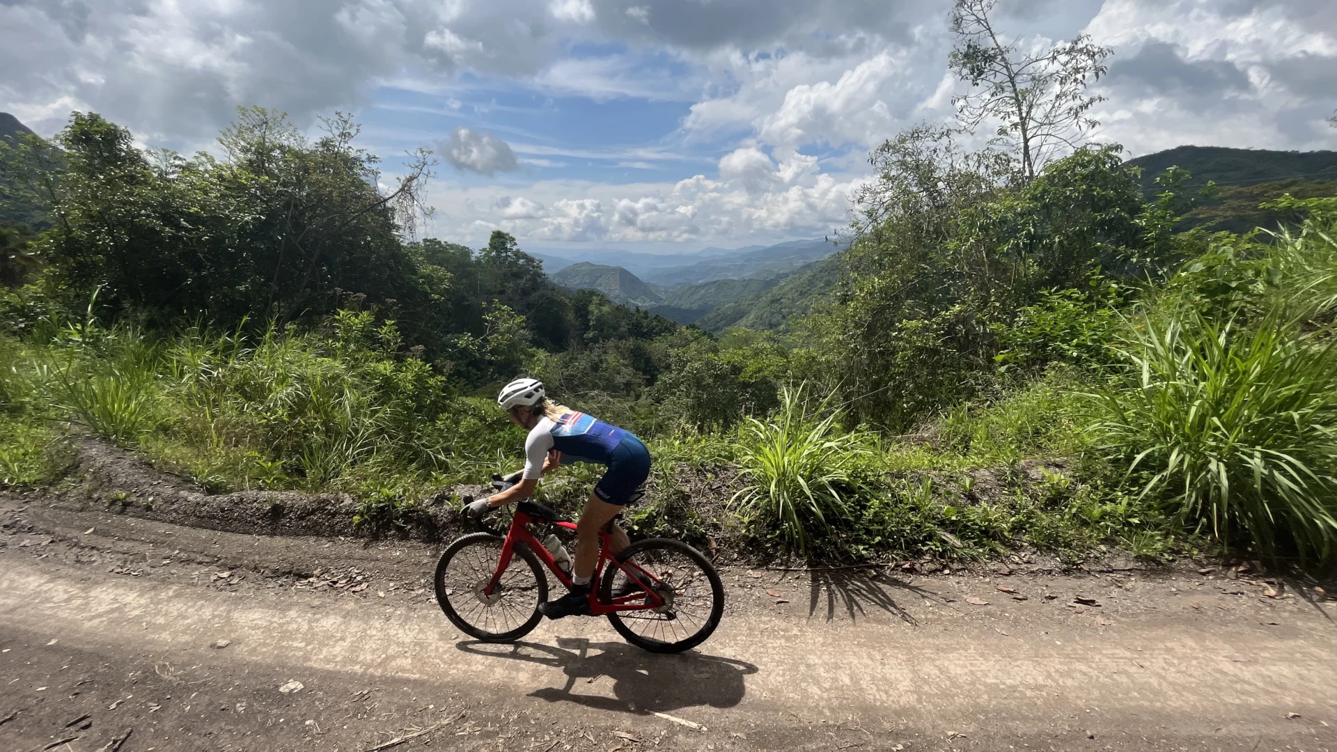 American female cyclist riding her gravel bike in Colombia.